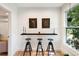 Small breakfast bar with three black stools, and window view at 2737 Sarazen Dr, Mount Pleasant, SC 29466