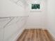Walk-in closet with wire shelving and wood flooring at 2737 Sarazen Dr, Mount Pleasant, SC 29466