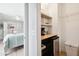 Walk-in closet with coffee bar, mini-fridge, and shelving at 2737 Sarazen Dr, Mount Pleasant, SC 29466