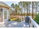 Deck overlooking tranquil waterway with wooded backdrop at 2737 Sarazen Dr, Mount Pleasant, SC 29466
