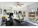 Home gym with treadmill, exercise bike, and backyard access at 2737 Sarazen Dr, Mount Pleasant, SC 29466