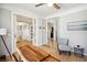 Bright home office with wood desk, mirrored closet, and hardwood floors at 2737 Sarazen Dr, Mount Pleasant, SC 29466