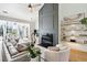 Spacious living room featuring a modern fireplace and built-in shelving at 2737 Sarazen Dr, Mount Pleasant, SC 29466