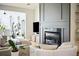 Bright living room with a gas fireplace and built-in shelving at 2737 Sarazen Dr, Mount Pleasant, SC 29466