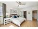 Main bedroom with king bed, ensuite bathroom, and hardwood floors at 2737 Sarazen Dr, Mount Pleasant, SC 29466