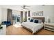 Main bedroom with king bed, access to deck, and hardwood floors at 2737 Sarazen Dr, Mount Pleasant, SC 29466