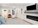Main bedroom with king bed, fireplace, and large TV at 2737 Sarazen Dr, Mount Pleasant, SC 29466