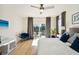 Main bedroom with king bed, access to deck, and hardwood floors at 2737 Sarazen Dr, Mount Pleasant, SC 29466
