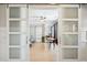 Home office with wood desk, sliding barn doors, and hardwood floors at 2737 Sarazen Dr, Mount Pleasant, SC 29466
