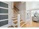 Elegant staircase with cable railing and hardwood treads at 2737 Sarazen Dr, Mount Pleasant, SC 29466