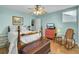 Bright bedroom with wood bed frame, dresser, and rocking chair at 2757 Jobee Dr # 1101, Charleston, SC 29414