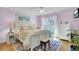 Light and airy bedroom with white furniture, and access to a deck at 2757 Jobee Dr # 1101, Charleston, SC 29414