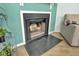 Cozy corner fireplace with a black tile hearth and a mantle at 2757 Jobee Dr # 1101, Charleston, SC 29414