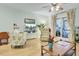 Living room with hardwood floors, comfortable seating, and a view of a screened porch at 2757 Jobee Dr # 1101, Charleston, SC 29414