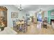 Bright living room with hardwood floors, fireplace, and access to a screened porch at 2757 Jobee Dr # 1101, Charleston, SC 29414
