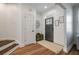 Modern entryway with dark door and wood floors at 2926 Split Hickory Ct, Johns Island, SC 29455