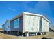 Single-story home with gray siding and large windows at 377 Seven Acres Rd, Saint George, SC 29477