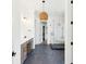 Spa-like bathroom with dark tile floors, a soaking tub, and a walk-in shower at 3917 Delinger Dr, Mount Pleasant, SC 29466