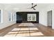 Spacious bedroom with hardwood floors, a ceiling fan, and a black accent wall at 3917 Delinger Dr, Mount Pleasant, SC 29466
