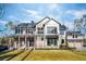 Two-story home with gray siding, large windows, and a three-car garage at 3917 Delinger Dr, Mount Pleasant, SC 29466