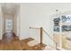 Bright hallway with hardwood floors and a wooden staircase at 3917 Delinger Dr, Mount Pleasant, SC 29466