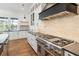 Modern kitchen with stainless steel appliances and a statement range hood at 3917 Delinger Dr, Mount Pleasant, SC 29466