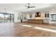 Open concept kitchen and living area with hardwood floors and view to backyard at 3917 Delinger Dr, Mount Pleasant, SC 29466