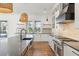 Modern kitchen with island, white cabinets, and hardwood floors at 3917 Delinger Dr, Mount Pleasant, SC 29466