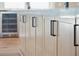 Close-up of light brown kitchen cabinets with black hardware at 3917 Delinger Dr, Mount Pleasant, SC 29466
