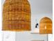 Close-up of stylish woven pendant lights illuminating a kitchen at 3917 Delinger Dr, Mount Pleasant, SC 29466