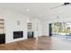 Open living space with fireplace, hardwood floors, and access to a pool at 3917 Delinger Dr, Mount Pleasant, SC 29466