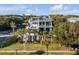 Luxury home with expansive decks and lush landscaping at 4001 Palm Blvd, Isle of Palms, SC 29451