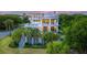 Multi-level home with expansive decks and lush landscaping at 4001 Palm Blvd, Isle of Palms, SC 29451