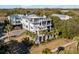 Luxury home with expansive decks and lush landscaping at 4001 Palm Blvd, Isle of Palms, SC 29451