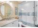 Bathroom with walk-in shower, white subway tile, and vanity at 4001 Palm Blvd, Isle of Palms, SC 29451