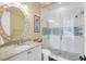 Bathroom with walk-in shower, white subway tile, and vanity at 4001 Palm Blvd, Isle of Palms, SC 29451