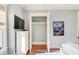 Bedroom with closet, dresser, and large TV at 4001 Palm Blvd, Isle of Palms, SC 29451