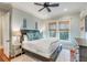 Spacious bedroom with a king-size bed and hardwood floors at 4001 Palm Blvd, Isle of Palms, SC 29451
