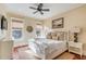 Main bedroom with king-size bed and en-suite bathroom at 4001 Palm Blvd, Isle of Palms, SC 29451
