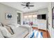 Bright bedroom with twin beds, window seat, and built-in dresser at 4001 Palm Blvd, Isle of Palms, SC 29451