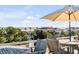 Ocean view deck with patio furniture and umbrella at 4001 Palm Blvd, Isle of Palms, SC 29451