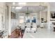Bright dining area with hardwood floors and white chairs at 4001 Palm Blvd, Isle of Palms, SC 29451