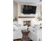 Living room fireplace with whitewashed brick and mantel at 4001 Palm Blvd, Isle of Palms, SC 29451