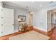 Light hallway with console table and rug at 4001 Palm Blvd, Isle of Palms, SC 29451