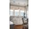 White kitchen with marble backsplash and hardwood floors at 4001 Palm Blvd, Isle of Palms, SC 29451
