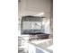 Modern kitchen features a professional range and custom cabinetry at 4001 Palm Blvd, Isle of Palms, SC 29451