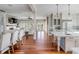 Open concept kitchen and living area with hardwood floors at 4001 Palm Blvd, Isle of Palms, SC 29451