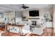 Coastal living room with hardwood floors and fireplace at 4001 Palm Blvd, Isle of Palms, SC 29451