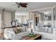 Spacious living room features white sofas, hardwood floors and an open concept design at 4001 Palm Blvd, Isle of Palms, SC 29451
