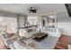 Open living room boasts white sofas, a large island, and hardwood floors at 4001 Palm Blvd, Isle of Palms, SC 29451
